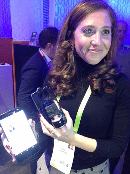 Liz Gross, Vital Chief Marketing Officer poses with Vital Moto Mod. Learn more about health monitoring via smartphone in the Prospector Knowledge Center.