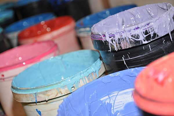 photo of buckets of paint - Learn about sedimentation and settling during storage