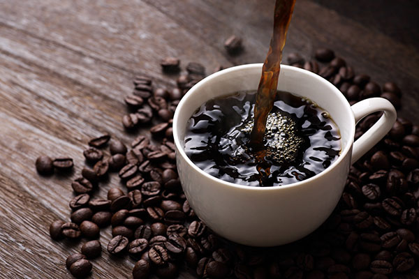 Photo of coffee cup and coffee beans - Coffee Industry Trends: Breaking Out of the Daily Grind