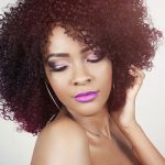 Woman with curly hair - learn the benefits and key ingredients in an effective hair conditioner formulation, plus current trends, in the Prospector Knowledge Center.