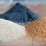 Piles of silicate sand - learn about waterborne silicate coatings in the Prospector Knowledge Center.