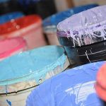 photo of buckets of paint - Learn about sedimentation and settling during storage