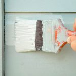photo of a person painting - learn more about polyurethane coatings
