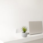 white table and laptop with plant - Learn more about brilliant white pigments