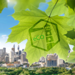 Leaf in front of a city with the eCO logo