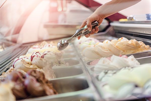 A person serving ice cream.